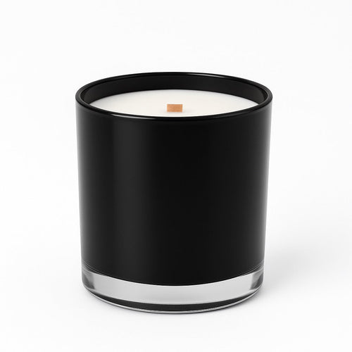 Black 12 oz wood wick candle in a slender vessel, delivering a warm, luxurious scent for elevated living.